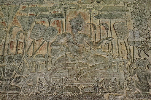 An ancient Asian stone  bas-relief mural of King Suryavarman II, the builder of Angkor Wat, Siem Reap Province, Cambodia