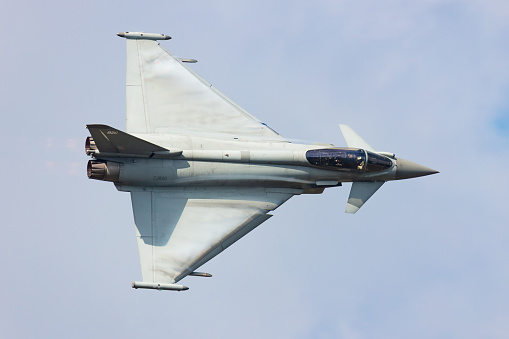 Radom, Poland - August 25, 2023: Royal Air Force Eurofighter Typhoon fighter jet plane flying. Aviation and military aircraft.