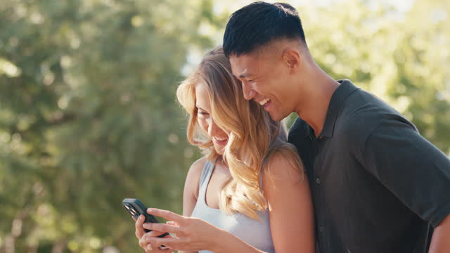 Smiling Couple Or Friends Posing For Selfie On Mobile Phone Outdoors In Countryside