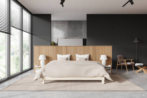 istock Stylish hotel bedroom interior with bed, armchair and panoramic window 2147510075