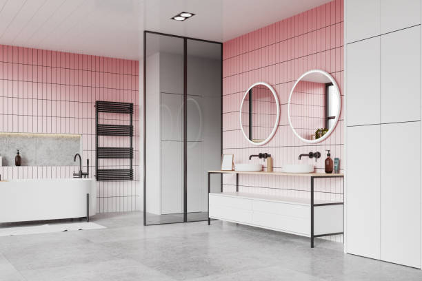 istock Hotel bathroom interior with bathtub and double sink with accessories 2147510196