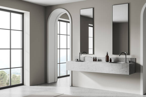 istock Stylish hotel bathroom interior with double sink and vanity, panoramic window 2147510343