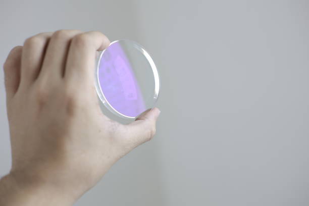 istock Glasses lenses, eyeglasses lenses in hand 2147511960