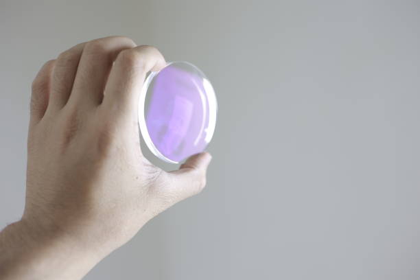 istock Glasses lenses, eyeglasses lenses in hand 2147511972