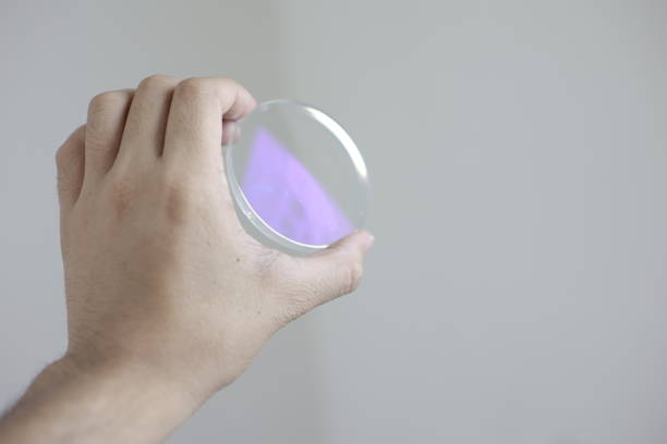 istock Glasses lenses, eyeglasses lenses in hand 2147511980