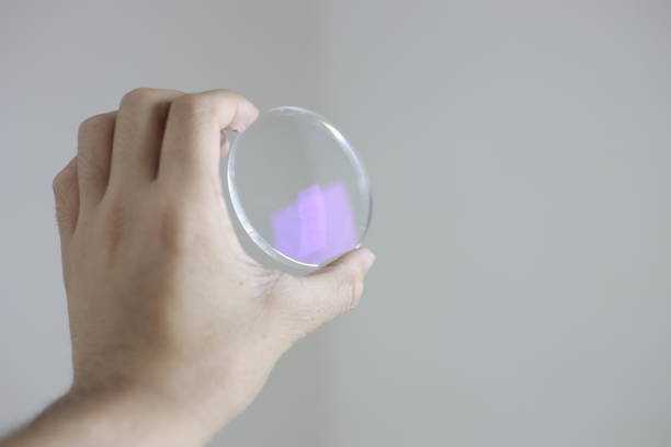 istock Glasses lenses, eyeglasses lenses in hand 2147511992