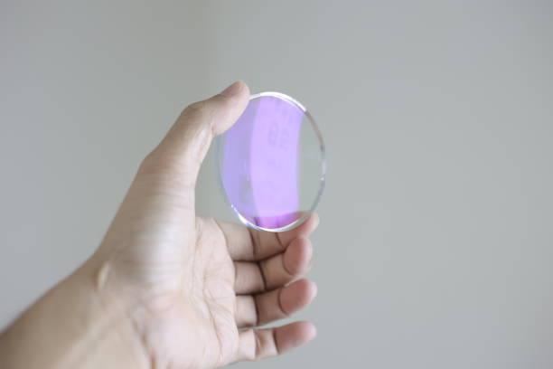 istock Glasses lenses, eyeglasses lenses in hand 2147512007