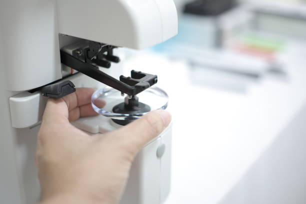 istock Glasses lenses, eyeglasses lenses in hand 2147512052
