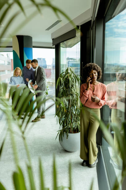 istock Radiant smile and casual networking in a modern office environment at midday 2147512322