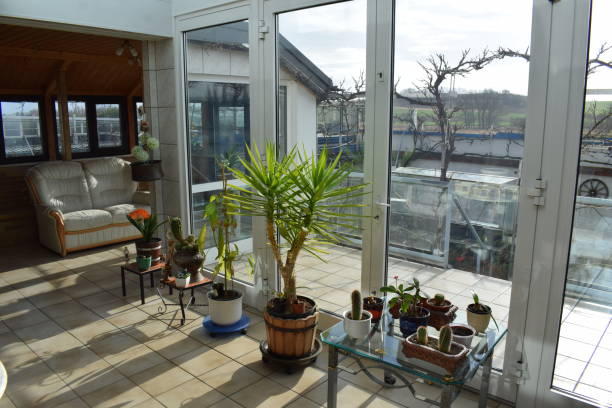 modern conservatory with a glass sliding door to the living room