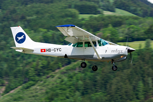 Zell am See, Austria - May 26, 2012: Commercial plane at airport and airfield. Small and sport aircraft. General aviation industry. Vip transport. Civil utility transportation. Fly and flying.