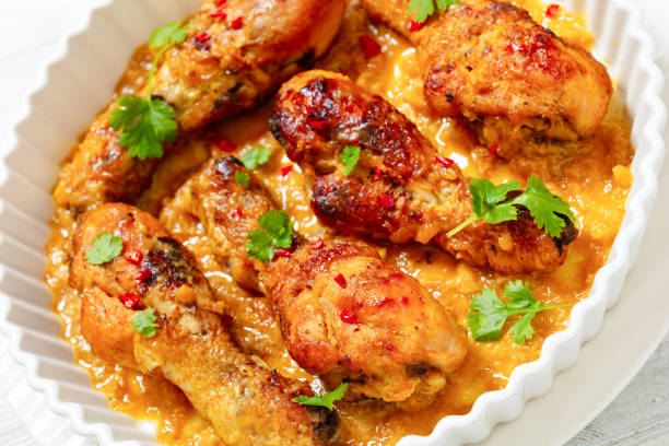 istock chicken drumsticks in pineapple sauce, top view 2147514618