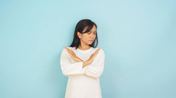 Asian woman rejection gesture