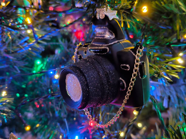 istock colorful Christmas ornaments hanging on the tree 2147517756