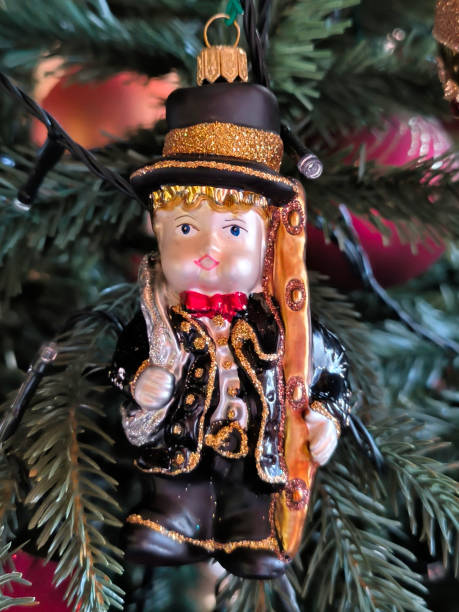 istock colorful Christmas ornaments hanging on the tree 2147517831