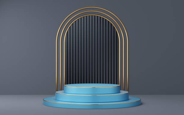 istock Empty blue cylinder podium with gold border on gray arch and black background. Abstract minimal studio 3d geometric shape object. Mockup space for display of product design. 3d rendering. 2147517877