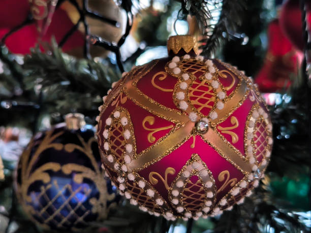 istock colorful Christmas ornaments hanging on the tree 2147517914