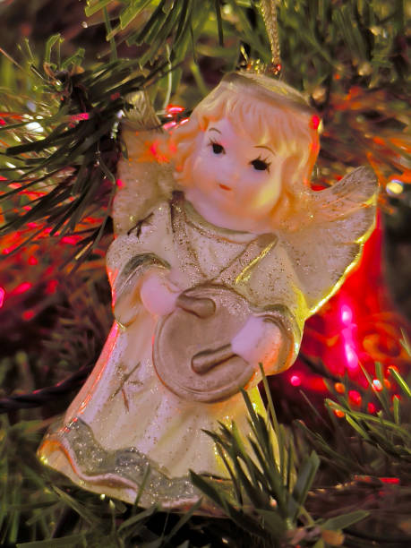 istock colorful Christmas ornaments hanging on the tree 2147518037
