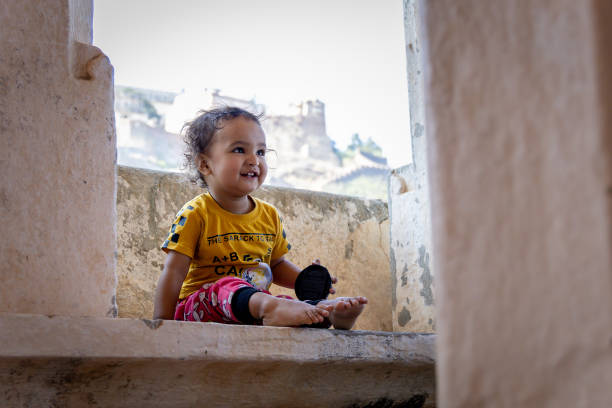 innocent child cute facial expression at outdoors at morning from flat angle