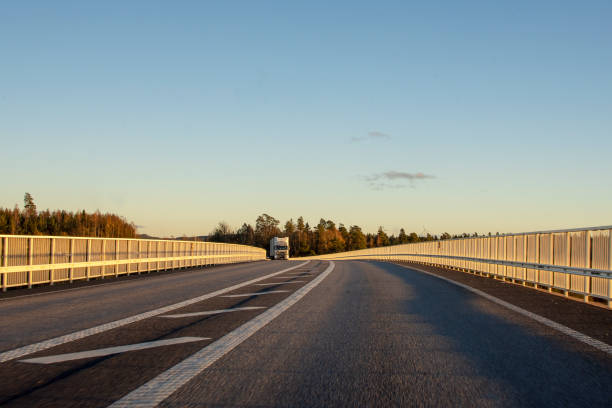 Truck approaching on highway a sunny clear day.