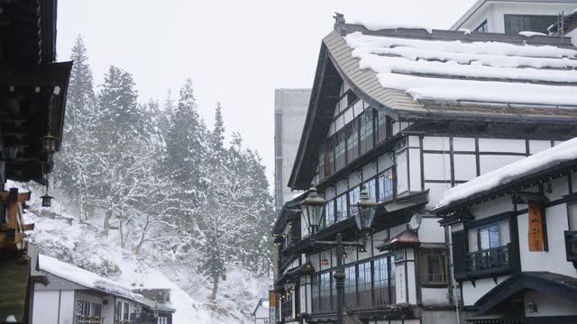 Snow Covered Eaves of Ryokans in Mountains of Ginzan Onsen, Yamagata Japan