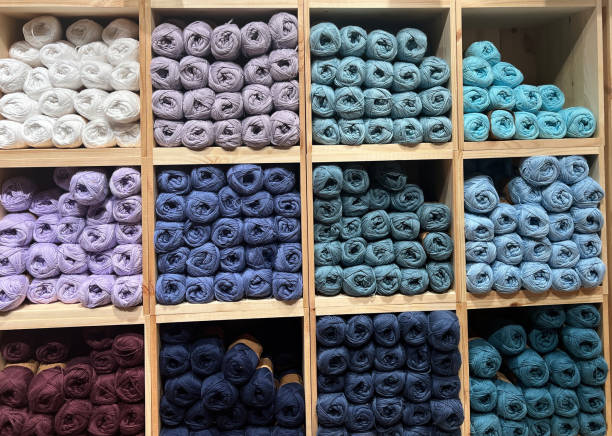 istock Hobby and knitting concepts. Multi-colored balls of wool on square shelves 2147518649