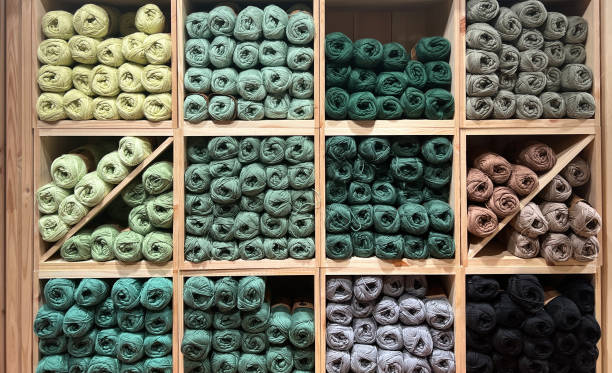 istock Hobby and knitting concepts. Multi-colored balls of wool on square shelves 2147518652