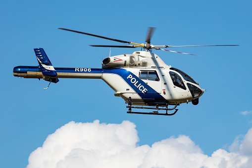 Siofok, Hungary - August 3, 2021: Government police helicopter at airport and airfield. Rotorcraft. General aviation industry. Police utility transportation. Air transport. Fly and flying.