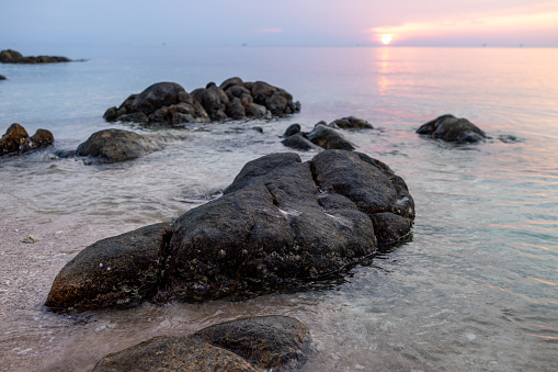 Rocks in the shallow sea at Ko Phangan Island, Thailand.