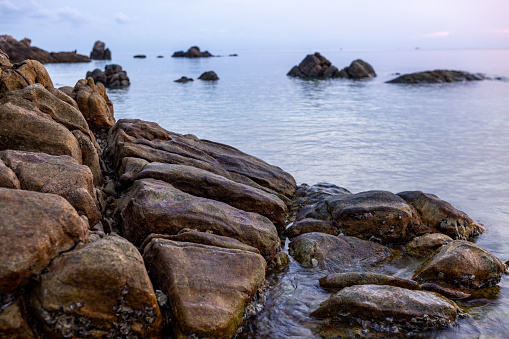 Rocks in the shallow sea at Ko Phangan Island, Thailand.