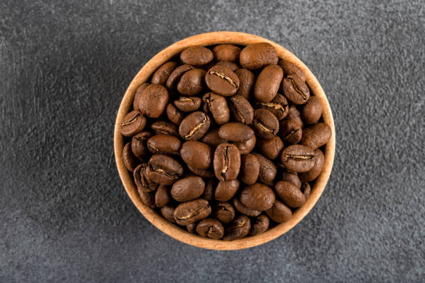 istock A bowl full of roasted coffee beans,on black background 2147521518