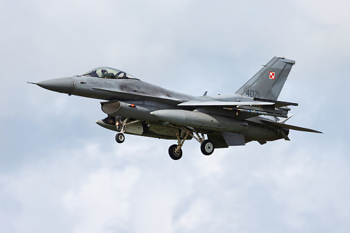 Leeuwarden / Netherlands - April 13, 2015: Polish Air Force Lockheed Martin F-16C Fighting Falcon 4071 fighter jet arrival and landing at Leeuwarden Air Base for Frisian Flag 2015 Air Exercise