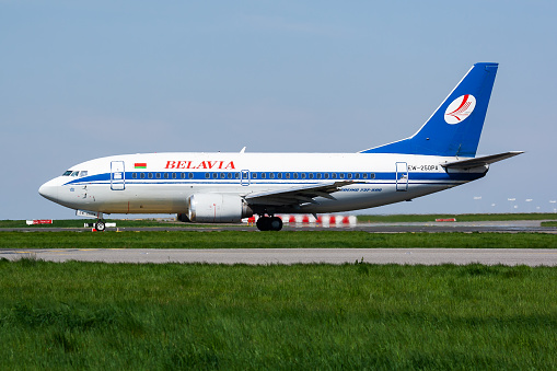 Paris, France - April 19, 2015: Belavia passenger plane at airport. Schedule air travel. Aviation and aircraft. Air transport. Global international transportation. Fly and flying.