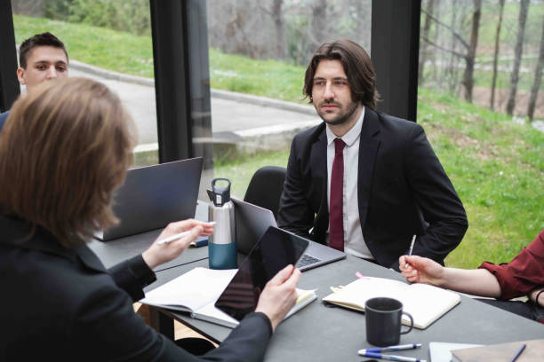 istock Young Confident Individuals Having a Meeting In The Office 2147522436