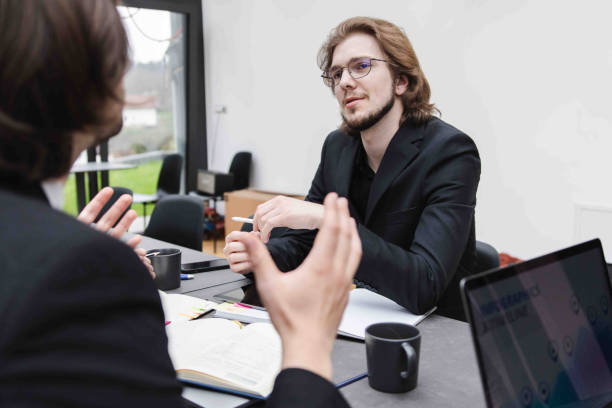 istock Young Confident Individuals Having a Meeting In The Office 2147522494