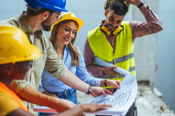 istock Team of architects and civil engineers inspecting construction site. 2147522999