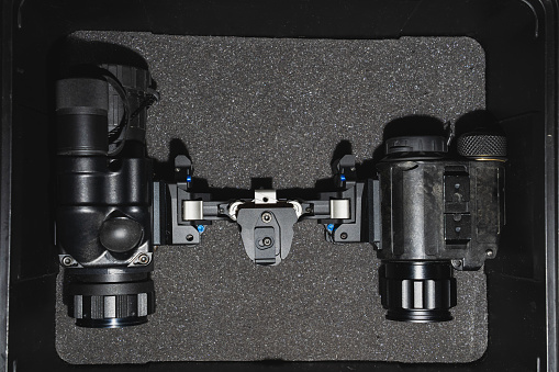 Modern millitary night vision device and thermal vision device in hardcase. Close up photo
