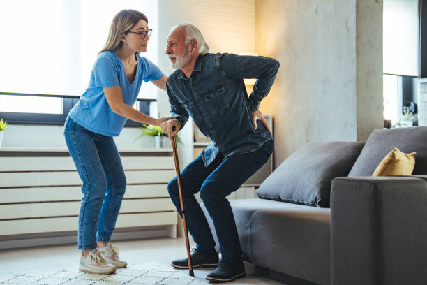 istock Smiling nurse assisting senior man to get up from bed. 2147527116