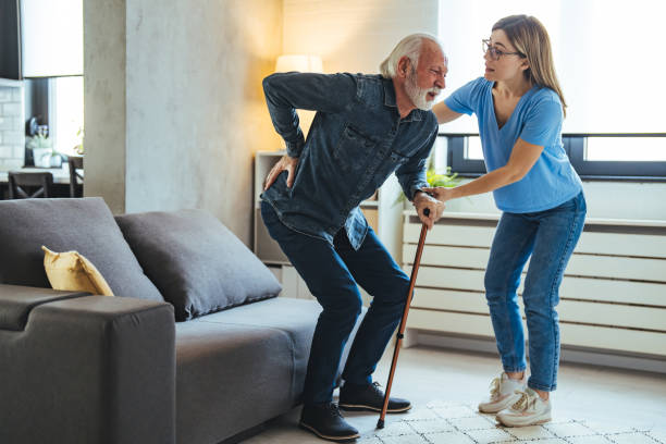 istock Smiling nurse assisting senior man to get up from bed. 2147527120