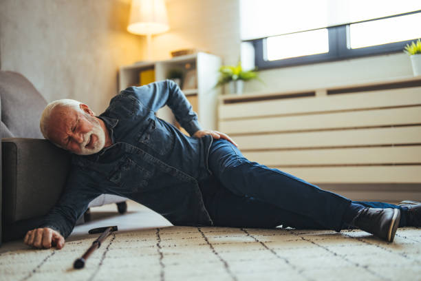 istock Senior men with cane falled down on floor at home 2147527396