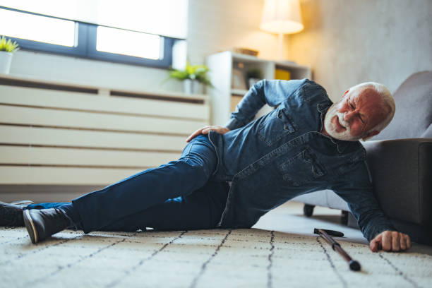 istock Senior men with cane falled down on floor at home 2147527403