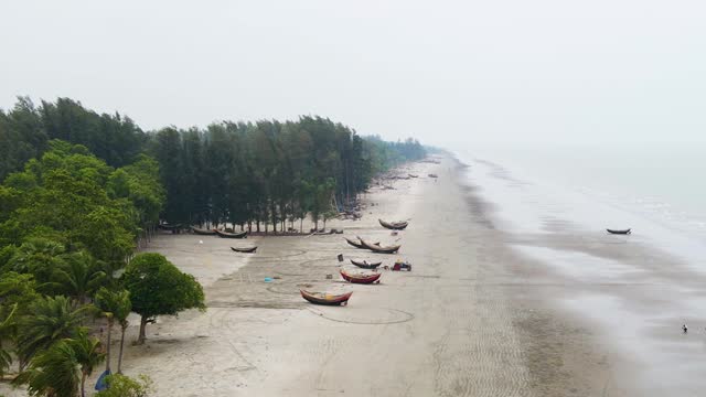Wooden fishing boats abandoned at the beach Bangladesh coast Indian ocean