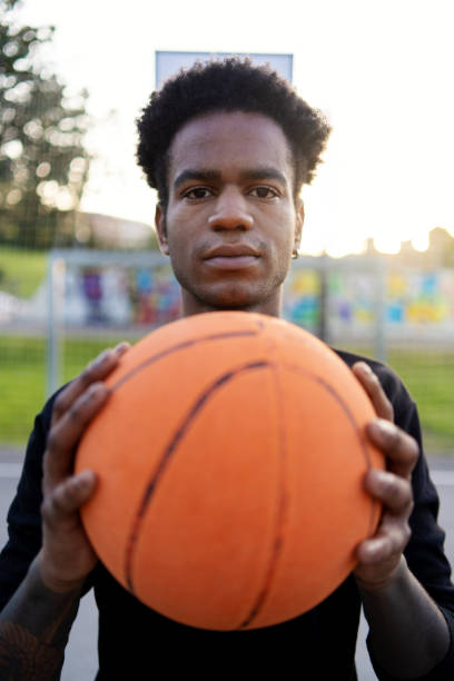 istock African american basketball player with ball 2147529453