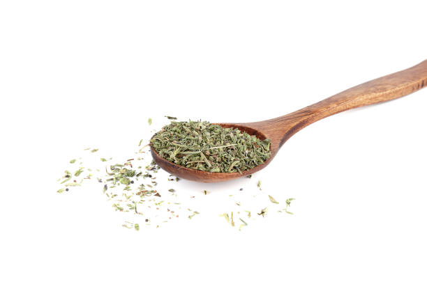 istock Dried thyme herb on wooden spoon and on white background. 2147530660
