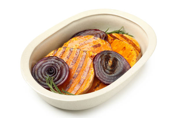 Baking tray with baked pumpkin isolated on white background.