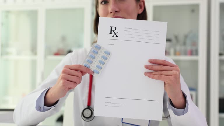 Professional woman doctor shows pills blister and prescription