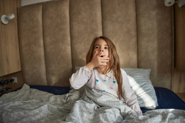 istock Adorable little girl waking up 2147532671