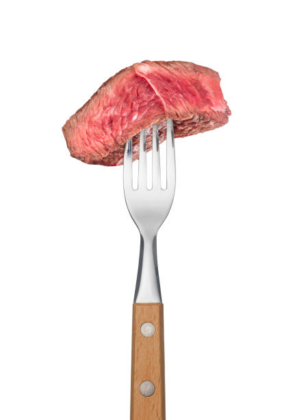 istock Slice of beef steak on meat fork on white background 2147532829