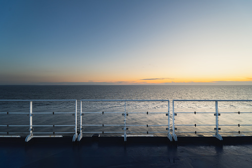 View from the deck of a cruise ship to the Baltic Sea in the early morning at sunrise. High quality photo