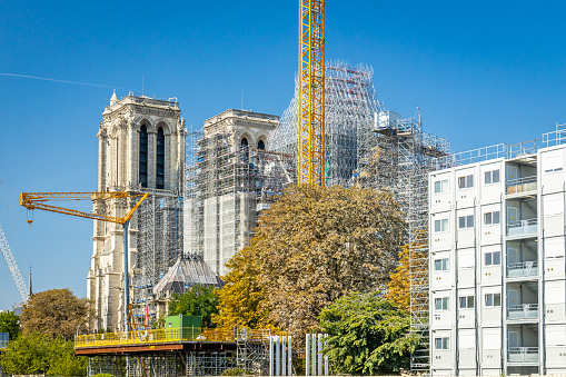 Paris, France - September 10, 2023 : Towers and new spire of Notre Dame cathedral under construction